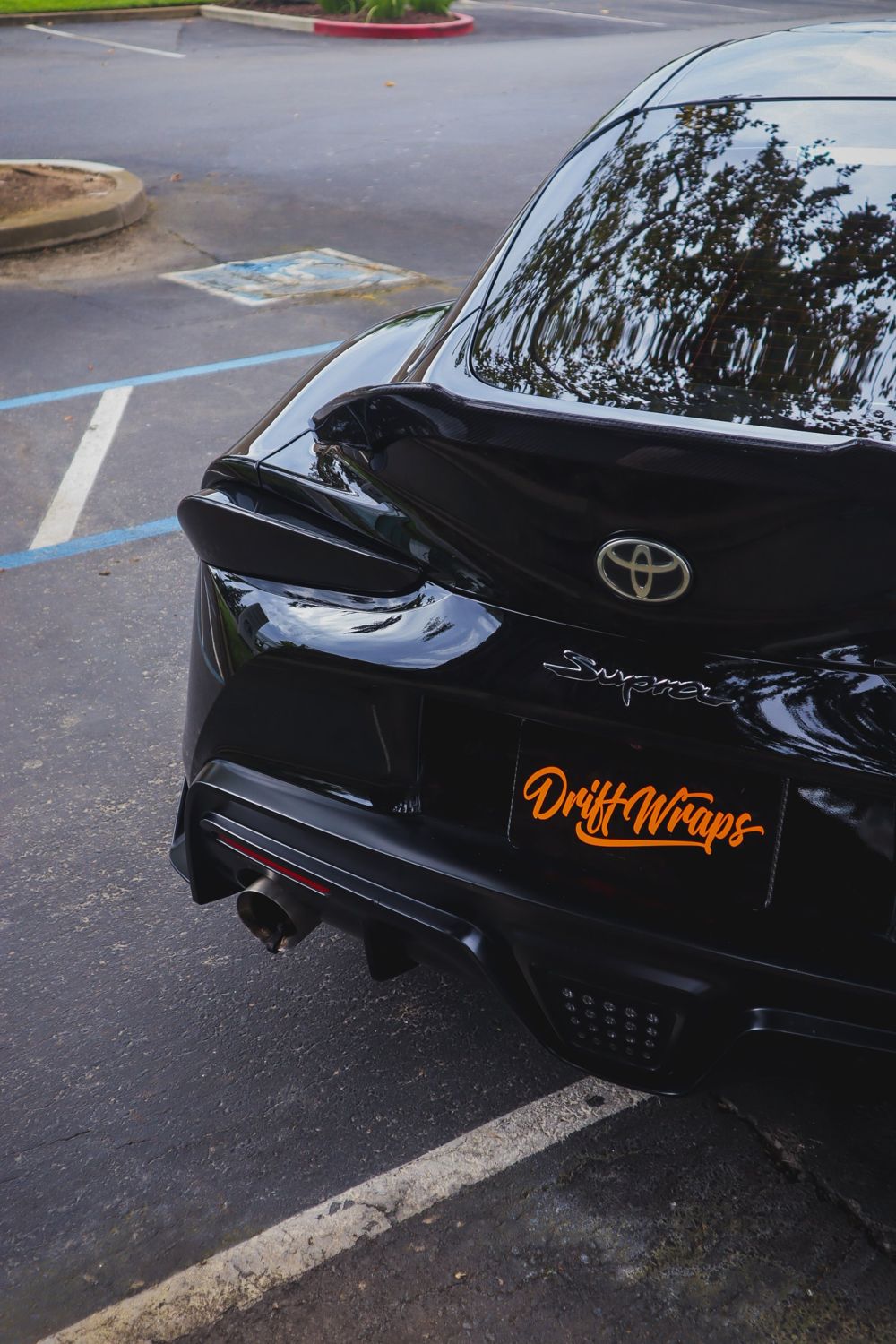 Rear of a black 2020 Toyota GR Supra wrapped in Gloss Black Obsidian color PPF by Drift Wraps in Rancho Cordova
