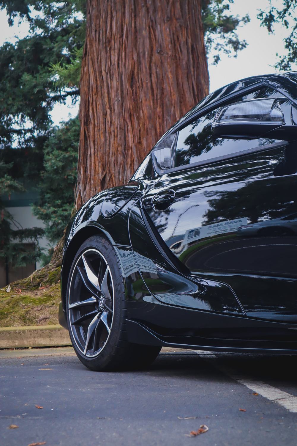 Front fender and door of a black 2020 Toyota GR Supra wrapped in Gloss Black Obsidian color PPF by Drift Wraps in Rancho Cordova