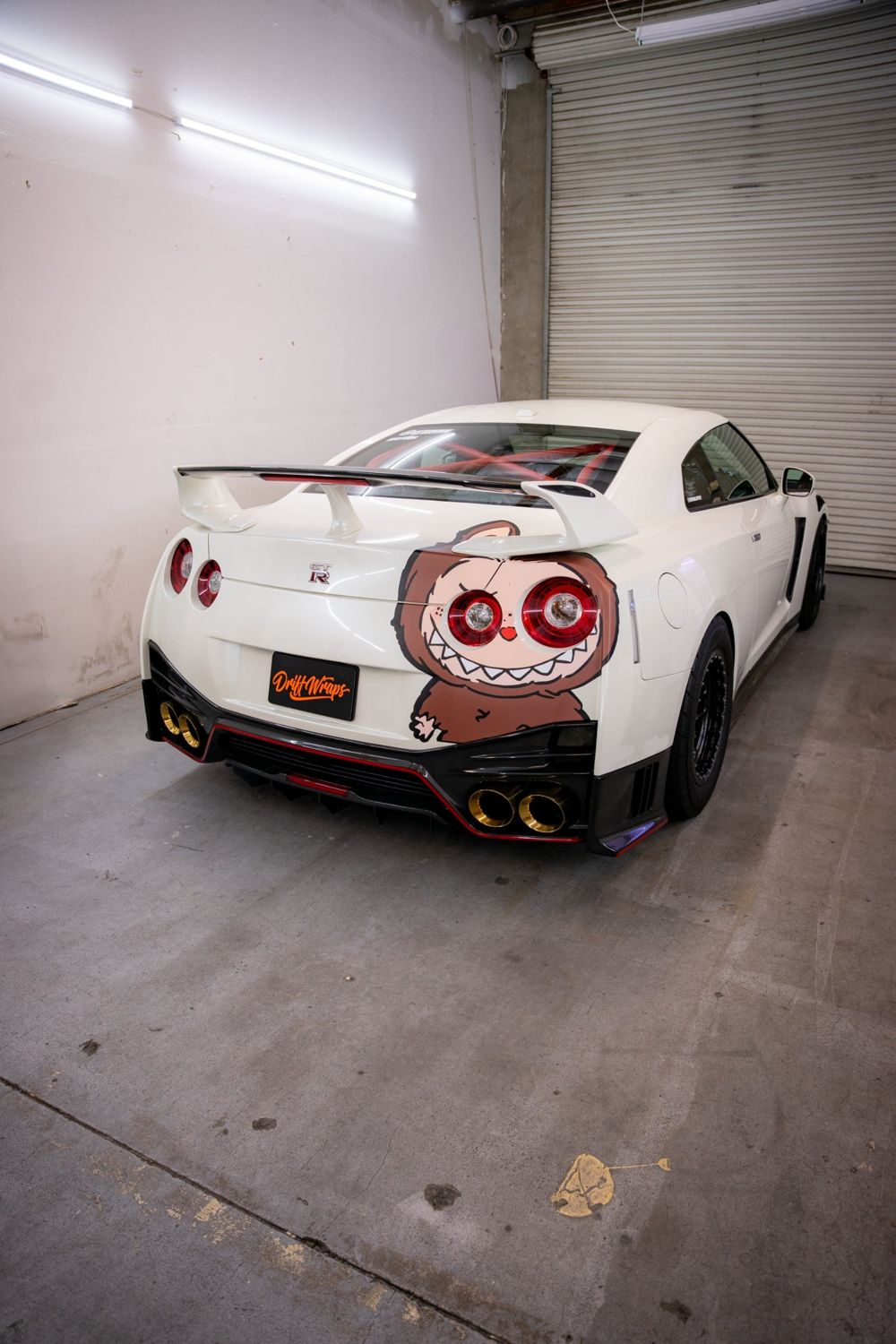 Rear of a Nissan GT-R R35 with a custom character graphic by Drift Wraps in Rancho Cordova
