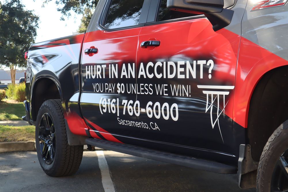 Door graphics on an Alexander Cherny Personal Injury Lawyer Chevrolet Silverado Z71 with a custom design 2/3 wrap by Drift Wraps in Rancho Cordova