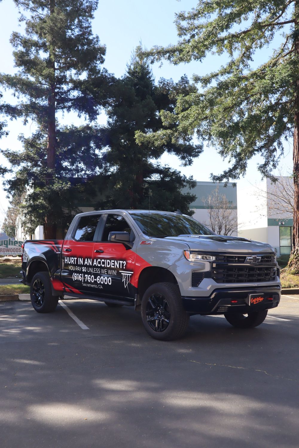 Front three-quarter view of an Alexander Cherny Personal Injury Lawyer Chevrolet Silverado Z71 with a custom design 2/3 wrap by Drift Wraps in Rancho Cordova