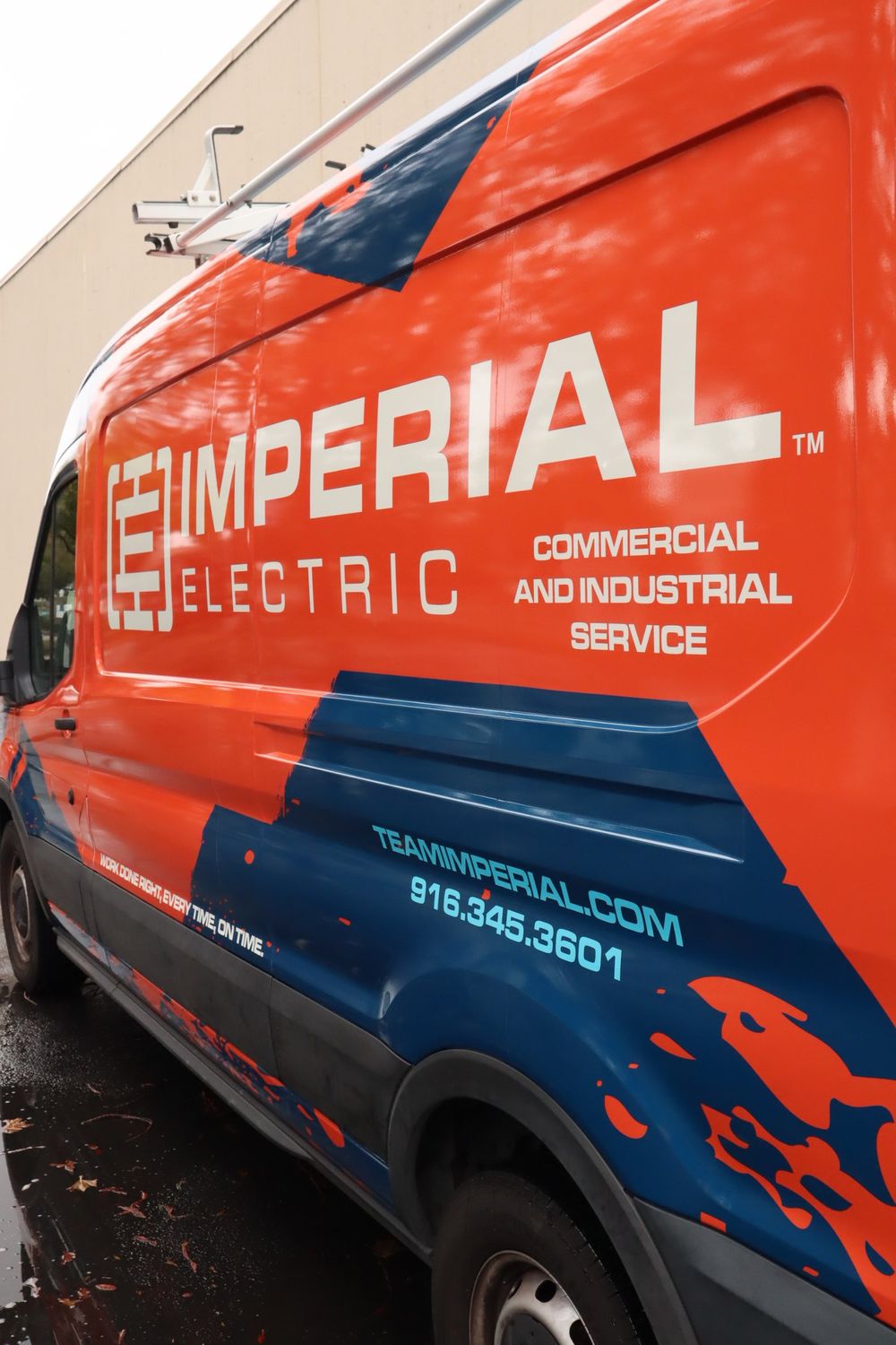 Side door and slogan on an Imperial Electric Ford Transit van with a full custom design wrap by Drift Wraps in Rancho Cordova