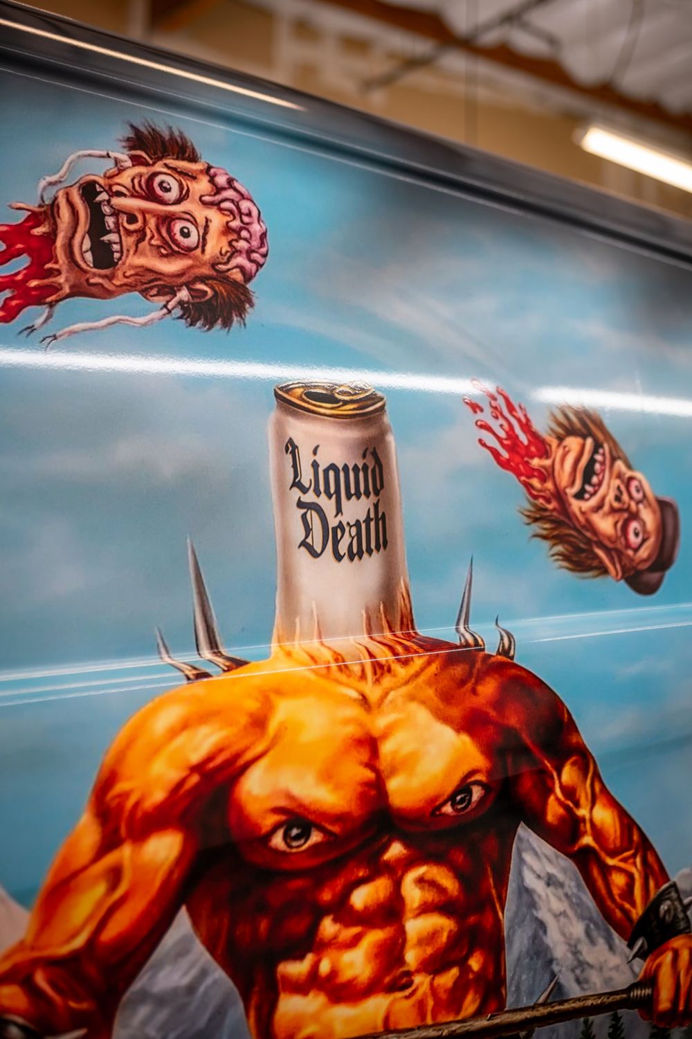 Close-up of the printed can artwork on a Liquid Death Mercedes-Benz Metris van with a themed full wrap by Drift Wraps in Rancho Cordova