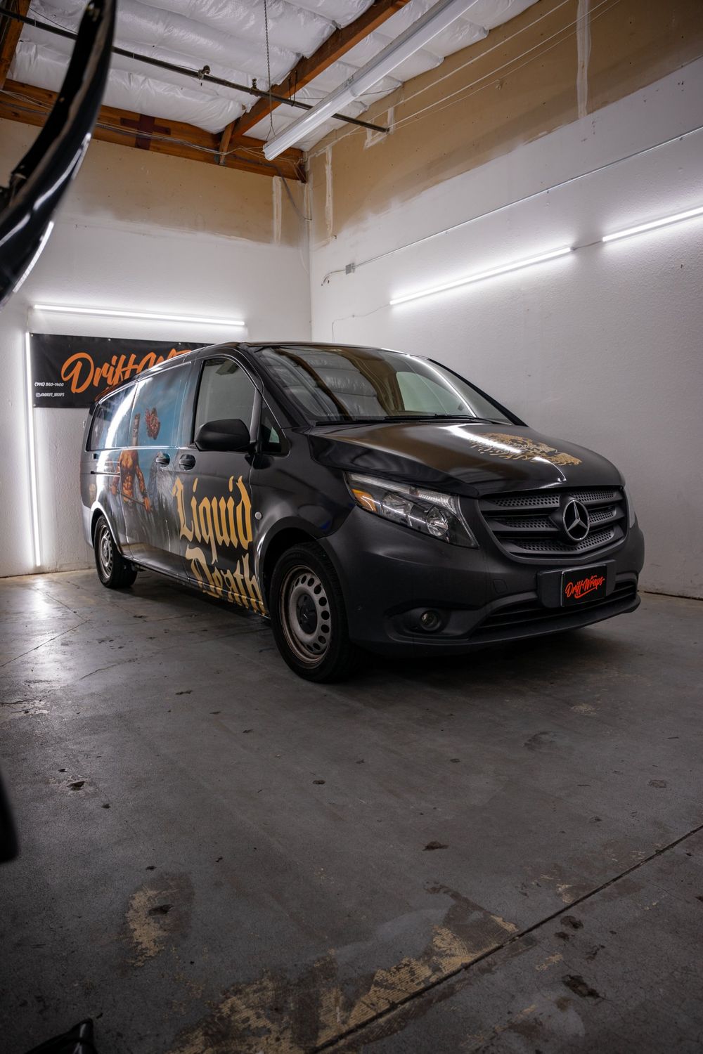 Front three-quarter view of a Liquid Death Mercedes-Benz Metris van with a themed full wrap by Drift Wraps in Rancho Cordova