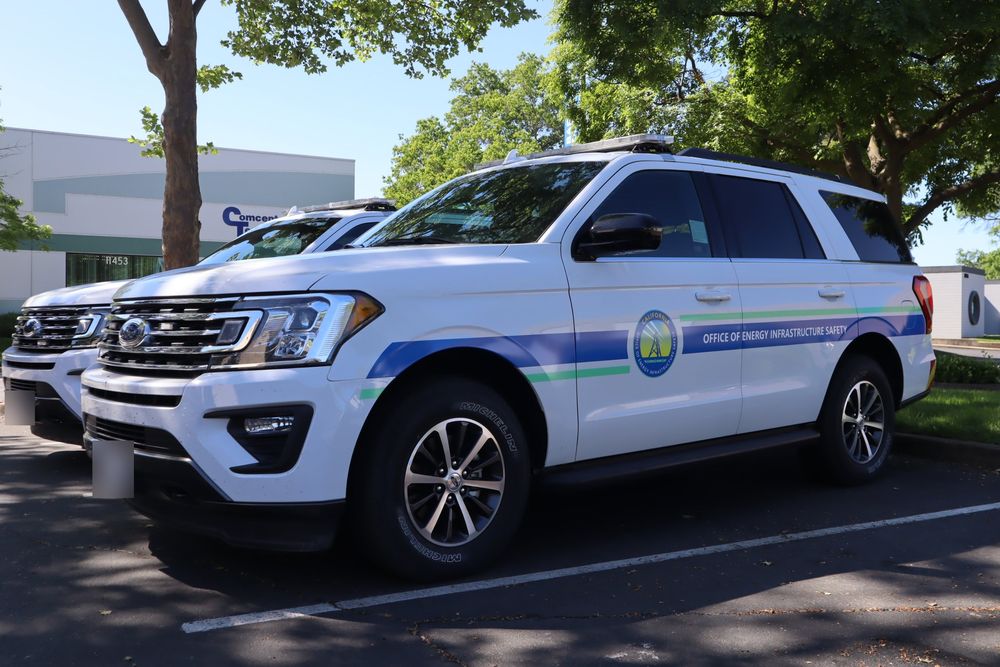 Side stripes and seal on a California state agency Ford Expedition with custom decals by Drift Wraps in Rancho Cordova