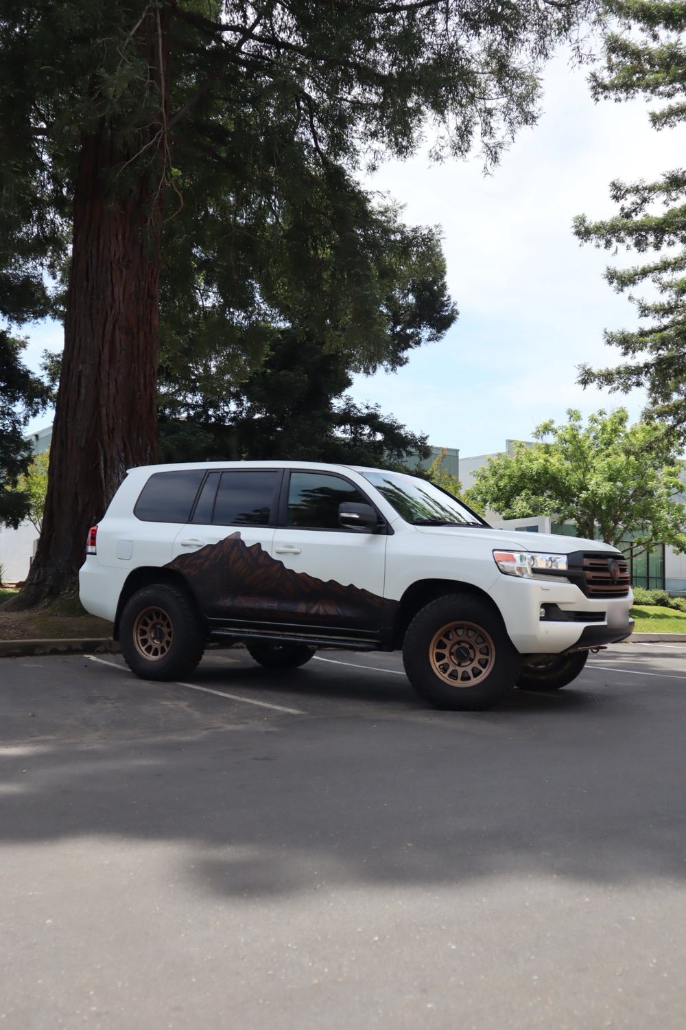 Side profile of a 2016 Toyota Land Cruiser with full-body matte PPF over custom graphics by Drift Wraps in Rancho Cordova
