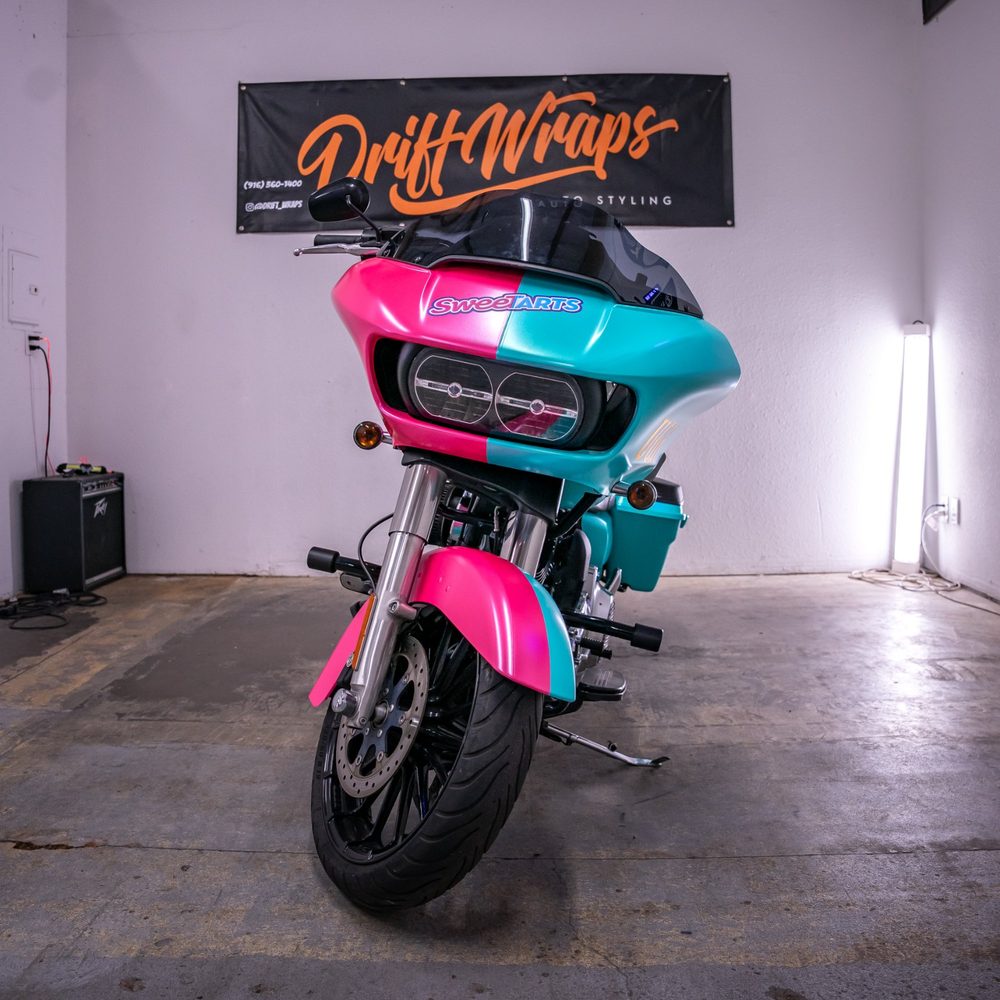 Front of a Harley-Davidson Road Glide with a half pink, half teal themed wrap by Drift Wraps in the Drift Wraps shop