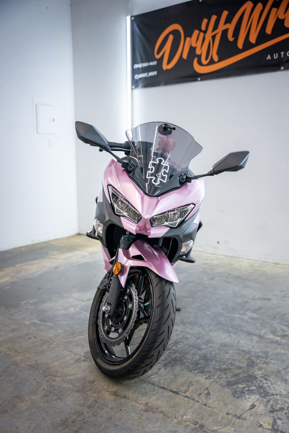 Front of a Kawasaki Ninja wrapped in TinyBot Metal Paint Passion Pink by Drift Wraps