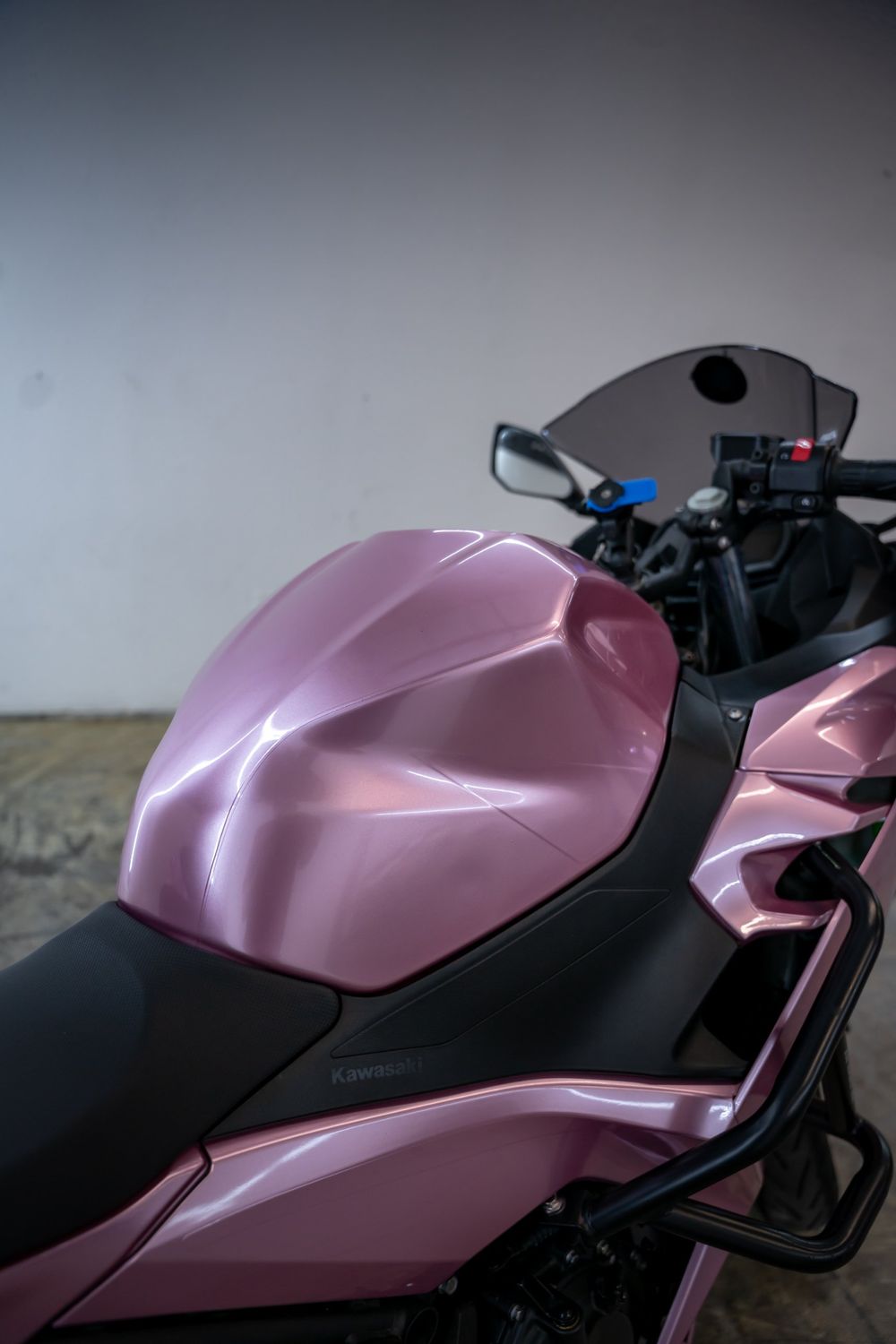 Tank of a Kawasaki Ninja wrapped in TinyBot Metal Paint Passion Pink by Drift Wraps
