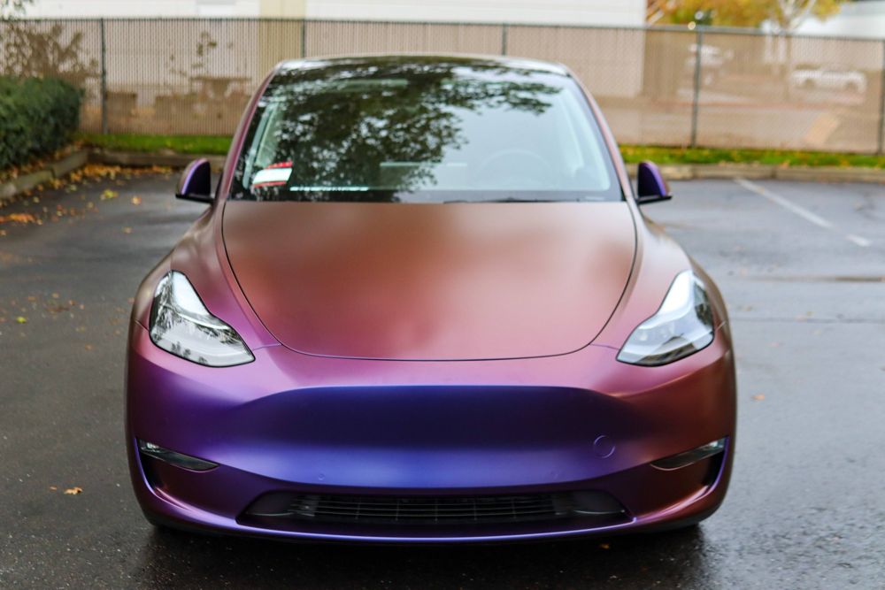 Front of a Tesla Model Y wrapped in Avery Dennison Satin Roaring Thunder by Drift Wraps