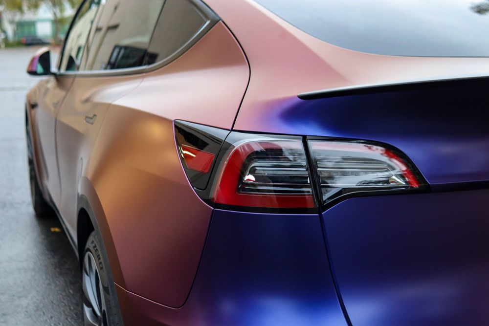 Taillight close-up on a Tesla Model Y wrapped in Avery Dennison Satin Roaring Thunder by Drift Wraps