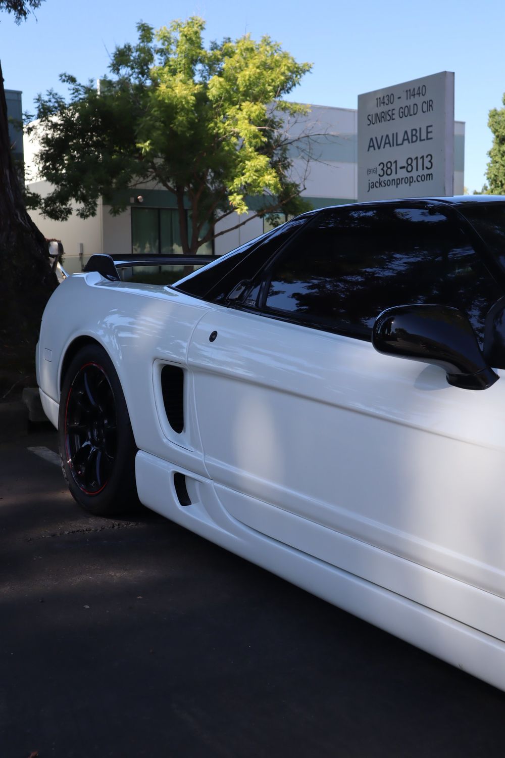 Tinted side glass and rear quarter of a white Acura NSX with LLumar ceramic window tint by Drift Wraps in Rancho Cordova