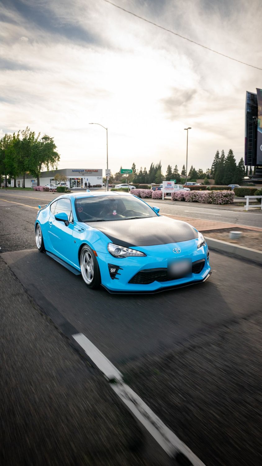 Rolling shot of a 2019 Toyota 86 wrapped in Aura Ultra Gloss Laguna Blue vinyl by Drift Wraps in Rancho Cordova