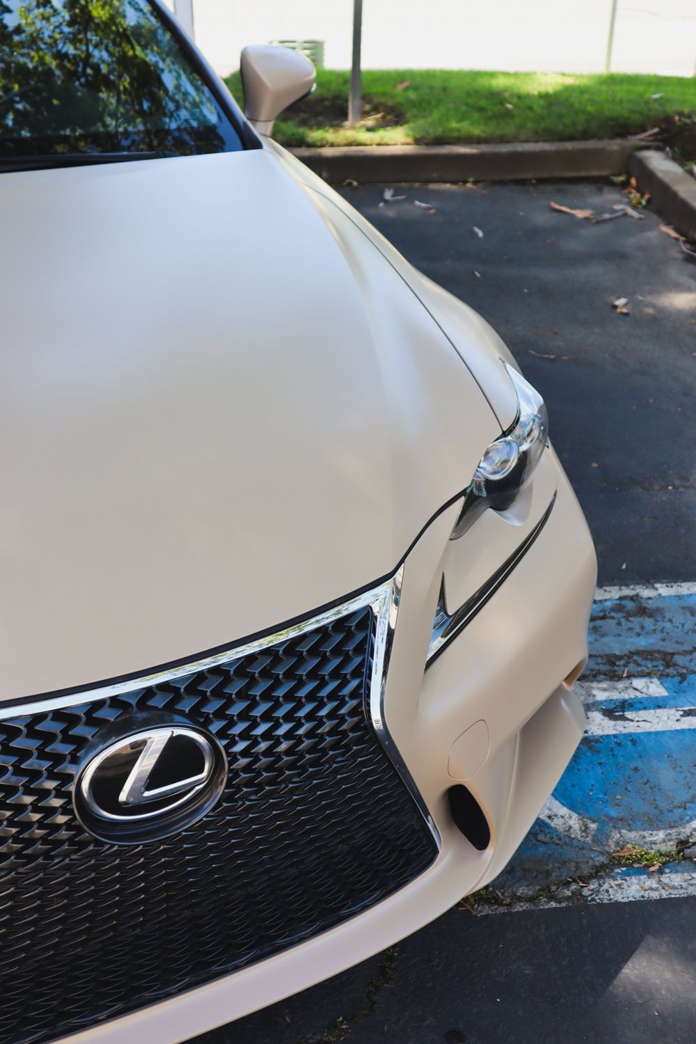 Front of a 2016 Lexus IS F Sport wrapped in KPMF Satin Stealth Tundra vinyl by Drift Wraps in Rancho Cordova