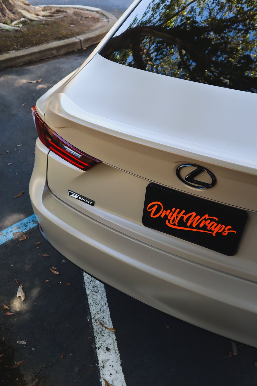 Rear of a 2016 Lexus IS F Sport wrapped in KPMF Satin Stealth Tundra vinyl by Drift Wraps in Rancho Cordova