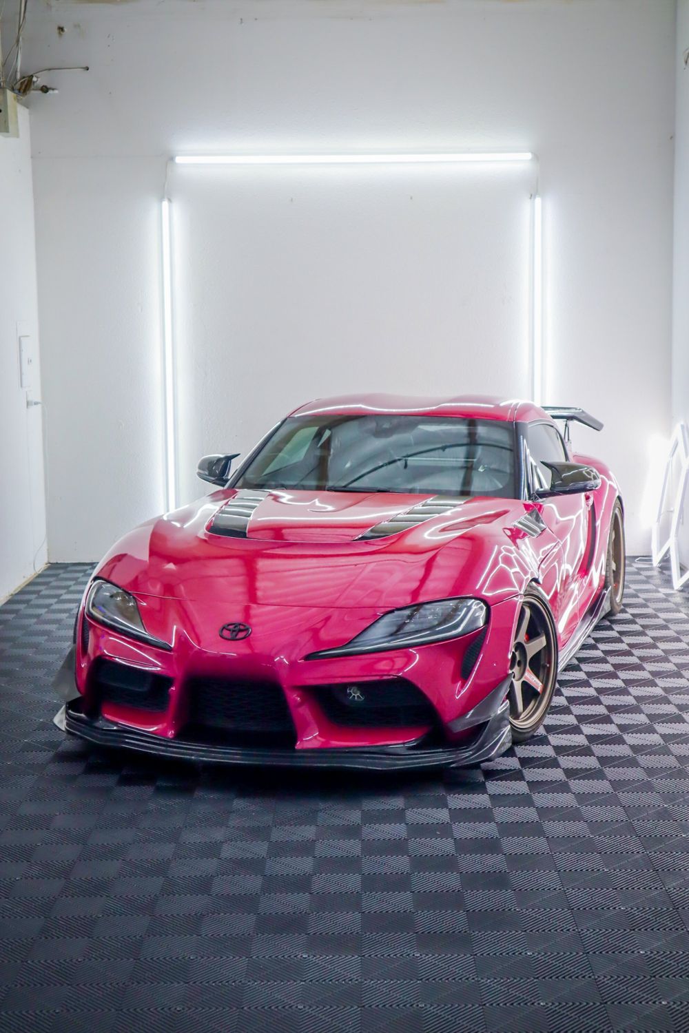Front of a 2022 Toyota GR Supra wrapped in 3M High Gloss Ruby Rosso vinyl by Drift Wraps in Rancho Cordova