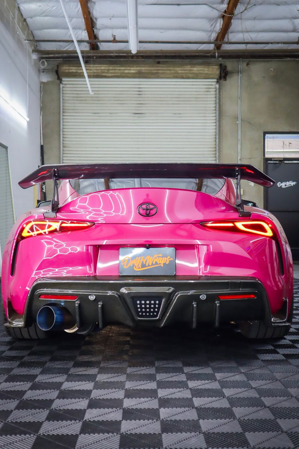 Rear of a 2022 Toyota GR Supra wrapped in 3M High Gloss Ruby Rosso vinyl by Drift Wraps in Rancho Cordova