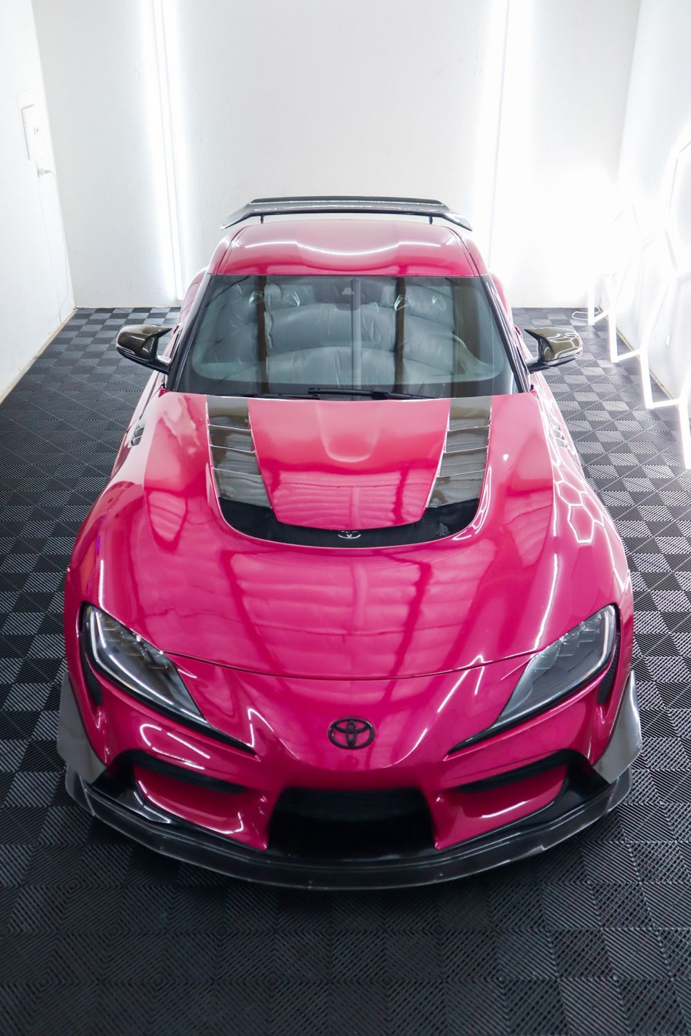 Overhead view of a 2022 Toyota GR Supra wrapped in 3M High Gloss Ruby Rosso vinyl by Drift Wraps in Rancho Cordova